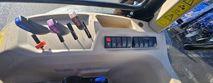 Close-up of a vehicle's dashboard with controls and buttons.